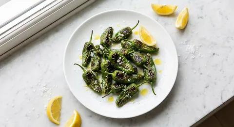 Blistered Padrón Peppers with Sea Salt and Lemon